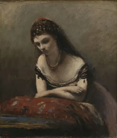 Young Woman Leaning On A Cushion