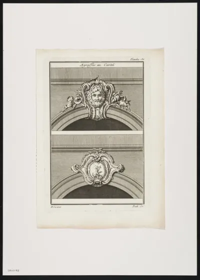 2 decorative keystones in the shape of a cartouche, decorated with plants and a mask.