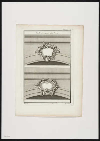 2 decorative keystones of a portal in the form of a cartouche, decorated with plants.