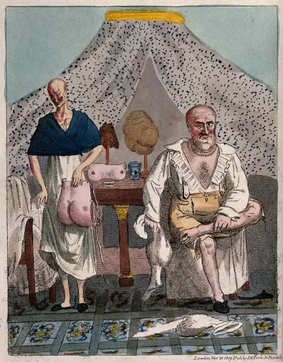 A bald couple with a variety of wigs and body pieces which they are changing around between them