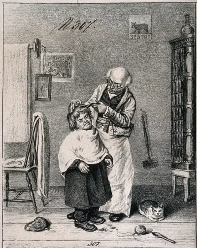 A barber cutting a boy's hair