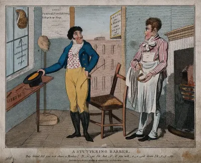 A barber in his shop preparing to shave a customer