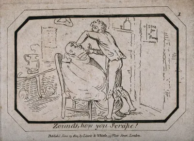 A barber shaving a man in his shop