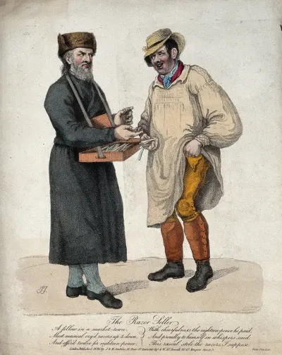 A bearded man selling razors to a farmer