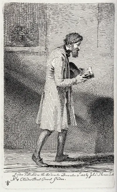 A bearded man walking the streets with his hat under his arm deeply engrossed in reading a book