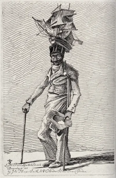 A black man in ragged clothes moving with the aid of crutches holds out his hat to beg for alms while wearing a miniature ship on his head