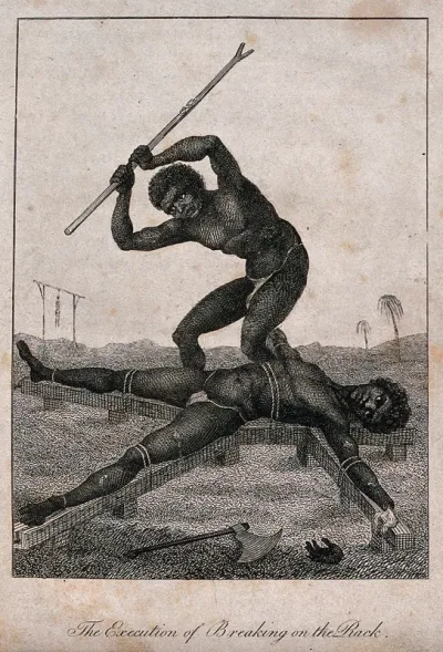 A black slave in Surinam is stretched on a rack as another black man breaks his bones with a wooden stick