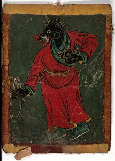 A black Tibetan demon with a boar's head, wearing a red and green dress