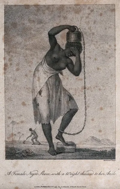 A black woman slave in Surinam holding a weight on her head which is attached by a chain to her ankle
