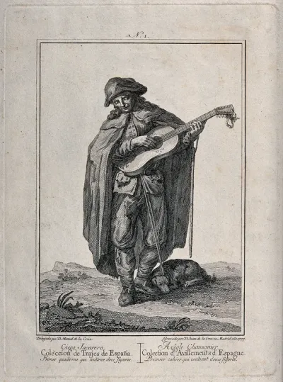 A blind singer wearing a long cloak is playing the guitar