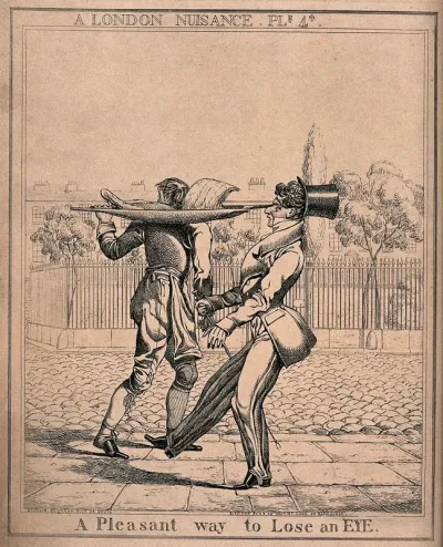 A boy is carrying meat on a container across his shoulders, the handles threaten to poke out the eye of a passer-by