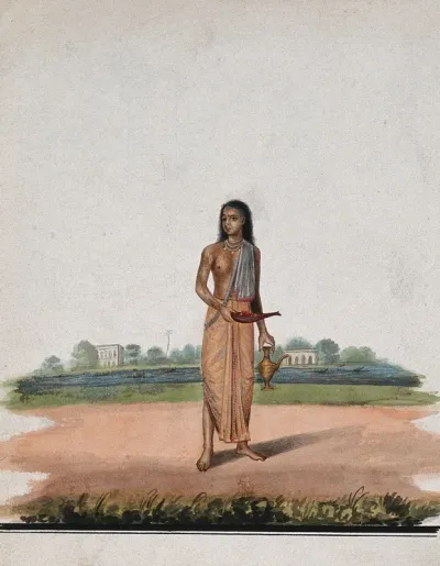 A brahmin carrying puja accessories