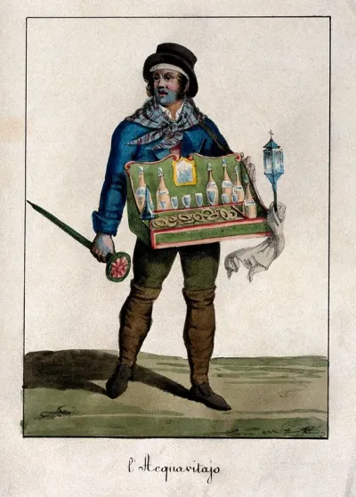 A brandy vendor is carrying his tray with glasses and bottles in it