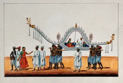 A bride and groom being carried in palanquin decorated with flowers by eight men on their shoulders, preceded by a dancing girl