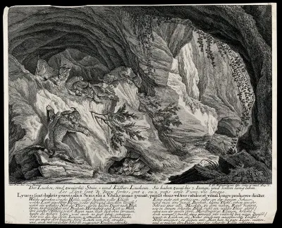 A cave in the mountains with five lynx and their kitten