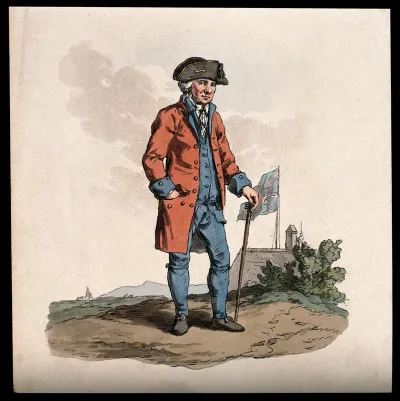 A Chelsea Pensioner, standing in a landscape: a building, flying the Union flag, behind him