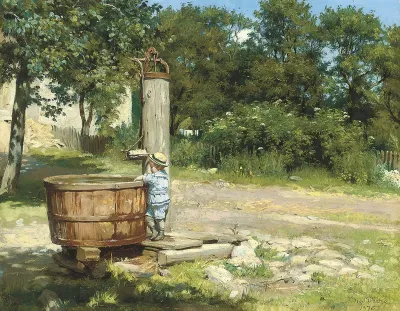 A child playing at a water pump .