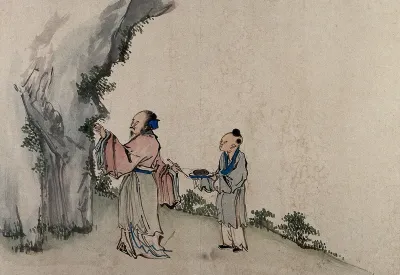 A Chinese artist assisted by a young man