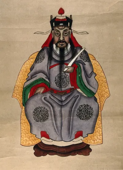 A Chinese deity with dark complexion and beard, seated on a throne