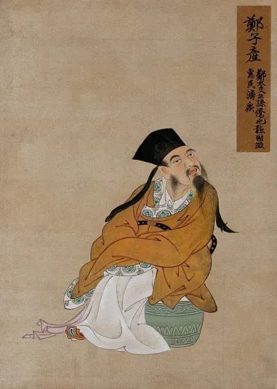 A Chinese figure, seated, wearing gold robes and black hat