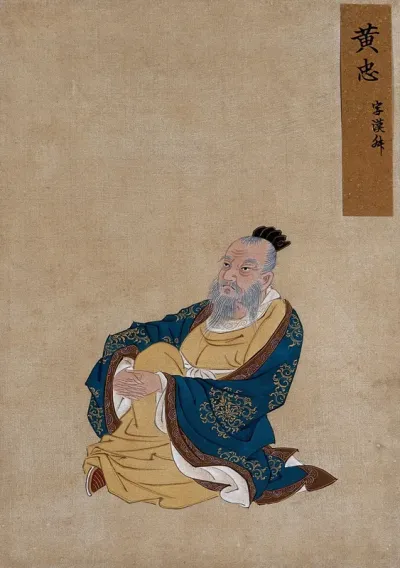 A Chinese figure with white beard, seated wearing indigo coloured silk robes with a brown border and buff undergarments
