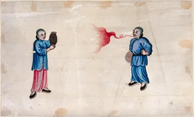A Chinese fire-eater and attendant