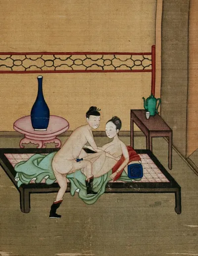 A Chinese man and woman making love in a sparsely decorated room