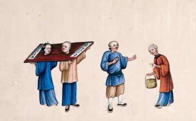 A Chinese man and woman shown with their necks enclosed in stocks known as the 'cangue'