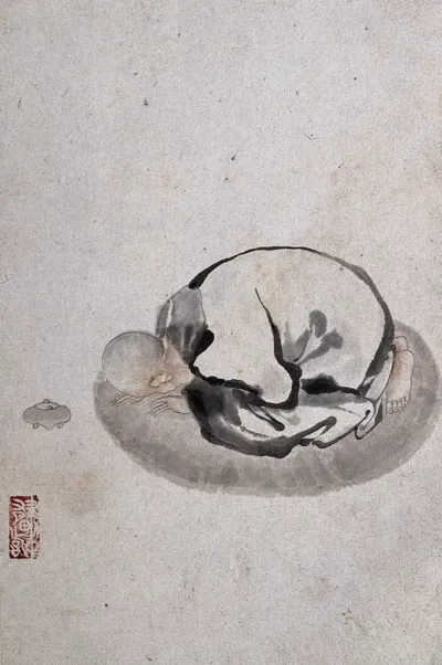 A Chinese man bending down in prayer or obeisance