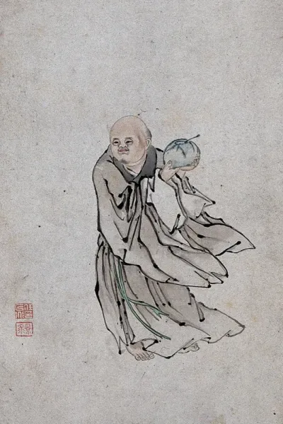 A Chinese man holding a bowl containing a spoon