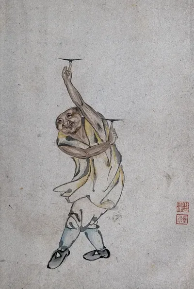 A Chinese man spinning plates on his index fingers