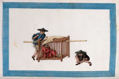 A Chinese prisoner in a wooden cage