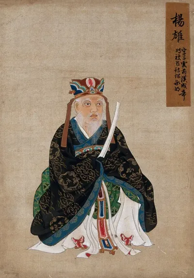 A Chinese seated figure with white beard, wearing an elaborate head-dress