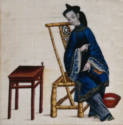 A Chinese woman busy at needlework
