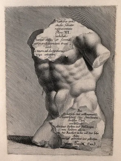 A chipped statue of a torso