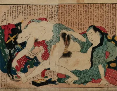 A couple engaged in sexual intercourse: the man is wearing a penis support