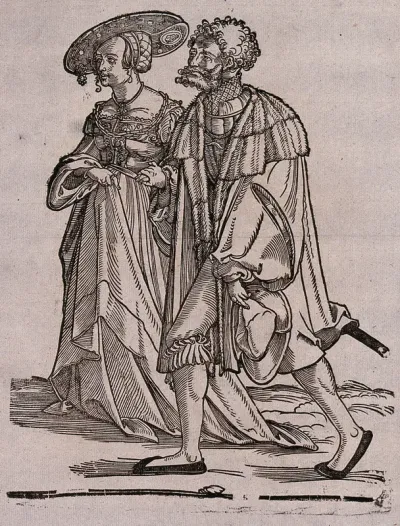 A couple in fashionable dress
