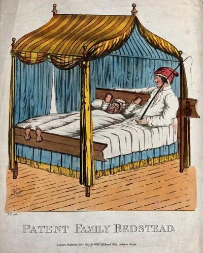 A couple lie in bed, the woman has her hands and feet padlocked into stocks at each end of the bed, and her husband has a whip