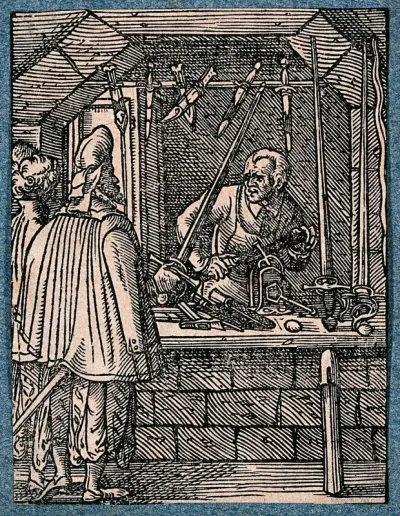 A cutler, or maker of knives, daggers and swords, working in his shop as a customer tests the weight of a sword
