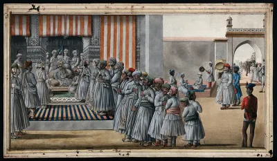 A darbar scene; the Nawab (?) sits on the chair listening to a man, while on the right, another man walks through the gateway towards the darbar