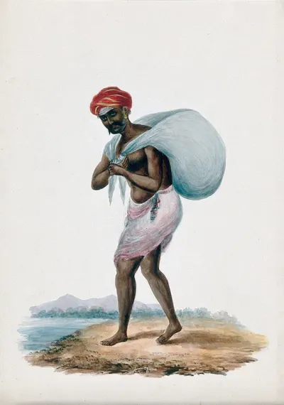 A dhobi (laundry man) talking a load of clothes to the river to clean