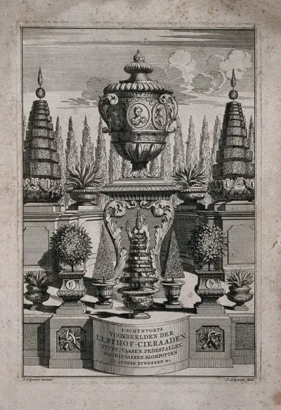A display of ornate plantpots and a large vase on a pedestal
