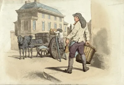 A dust cart with a refuse collector (dustman) ringing a bell to collect household rubbish