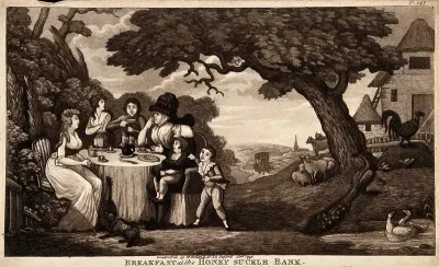 A family sits round a table having breakfast