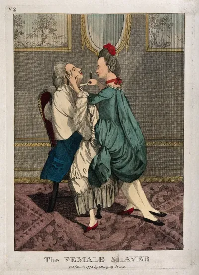 A female barber shaving a man while astride him