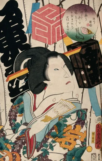 A female-role actor against a lavishly decorated stage curtain