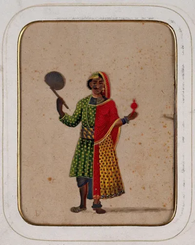 A figure dressed as half male and half female, holding a fan in one hand and a ritual object in the other