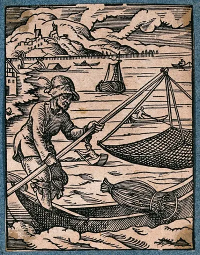 A fisherman on his boat at sea, with a lobster pot, lowering a lift net