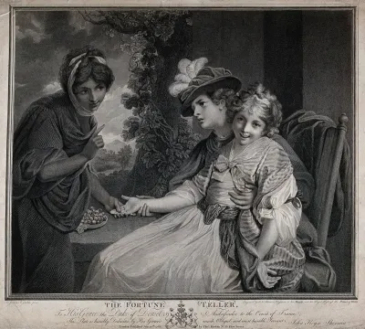 A fortune-teller is reading the palm of a woman with little girl on her lap