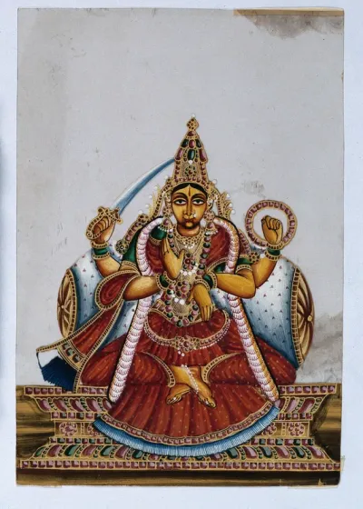 A four armed Indian goddess with her lower right hand raised in a abhaya mudra, upper right holding a sword and her upper left arm holding a chakra